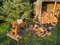 Log splitter with firewood for the winter Royalty Free Stock Photo