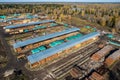 Log storage for sawn timber for export. Lumberjack port business concept. Aerial top view