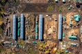 Log storage for sawn timber for export. Lumberjack port business concept. Aerial top view