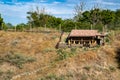 Log storage shed at the top of the hill surrounded by trees Royalty Free Stock Photo