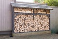 Log store full of seasoned logs for woodburner