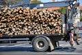 Log transporter truck on the city street Royalty Free Stock Photo
