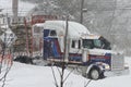 Log truck in blizzard Royalty Free Stock Photo
