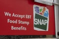 SNAP and EBT Accepted here sign. SNAP and Food Stamps provide benefits to supplement the budgets of disadvantaged families