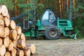 Logging equipment in the forest, loading logs for transportation. Harvesting and storage of wood in the forest. Transportation of Royalty Free Stock Photo