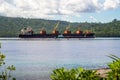 Logging ship and barge in Marovo Lagoon in the Solomon Islands. Royalty Free Stock Photo