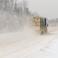 Logging truck on winter road Royalty Free Stock Photo