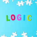 LOGIC text with white puzzle jigsaw pieces on blue background. Concepts of logical thinking, Conundrum, solutions, rational,