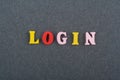 LOGIN word on black board background composed from colorful abc alphabet block wooden letters, copy space for ad text. Learning