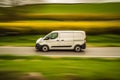 Logistic Delivery van on a country road panning effect. Generative Ai Royalty Free Stock Photo