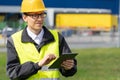 Logistician with digital tablet on a background of logistic center