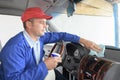 Logistician wiping interior vehicle