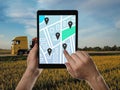 Logistics. Man using tablet with map on screen against truck Royalty Free Stock Photo