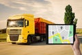 Logistics. Man using tablet with map on screen against truck Royalty Free Stock Photo