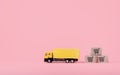 Logistics, and delivery service - Cargo truck and paper cartons or parcel with a shopping cart logo on Pink background. Shopping Royalty Free Stock Photo