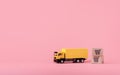 Logistics, and delivery service - Cargo truck and paper cartons or parcel with a shopping cart logo on Pink background. Shopping Royalty Free Stock Photo