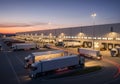 Logistics Distribution Center With Trucks At Dusk Royalty Free Stock Photo