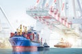 Logistics import export background and transportation industry of international container cargo ship with tugboat on port crane Royalty Free Stock Photo