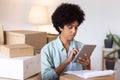 Logistics manager examining parcel tracking Royalty Free Stock Photo