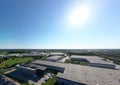 Logistics park with warehouse. Semi-trailers trucks standing on car parking and waiting for loading and unloading goods at ramps. Royalty Free Stock Photo