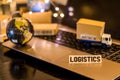 Logistics - still life logistics business concept with laptop, phone, mini shipping cartons Royalty Free Stock Photo