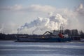 Logistics and transportation Cargo ship with ports crane bridge coming in port Royalty Free Stock Photo