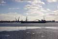 Logistics and transportation Cargo ship with ports crane bridge coming in port Royalty Free Stock Photo