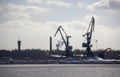 Logistics and transportation Cargo ship with ports crane bridge coming in port Royalty Free Stock Photo