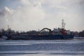 Logistics and transportation Cargo ship with ports crane bridge coming in port Royalty Free Stock Photo