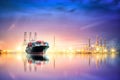 Logistics and transportation of Container Cargo ship and Cargo plane with working crane bridge in harbor at Twilight sky, logistic