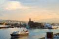 Logistics and transportation of international container cargo ship with ports crane bridge in harbor at dusk for import export Royalty Free Stock Photo