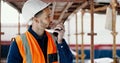 Logistics worker, walkie talkie and man on a construction site working on a building project. Architecture