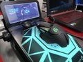 Logitech G502 Hero gaming mouse inside an electronic store on a stand