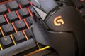 Logitech g502 hero gaming mouse on red illuminated gaming keyboard, close up shot. devices to play on the pc. Verona, 08-02-21 Royalty Free Stock Photo