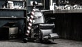 Logo of the barbershop, symbol. Stylish vintage barber chair. Hairstylist in barbershop interior. Barber shop chair Royalty Free Stock Photo