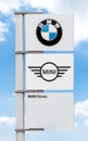 Logo BMW and MINI on pole with blue sky background Royalty Free Stock Photo