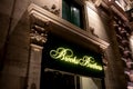 The logo of the Brooks Brothers outlet chain above one of its stores in Malta at night