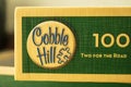 The logo of the Canadian company Cobble Hill on a box of jigsaw puzzles. Close-up.