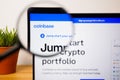 Logo of Coinbase on a laptop screen under a magnifying glass Royalty Free Stock Photo