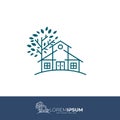 logo of a comfortable house and a big tree Royalty Free Stock Photo