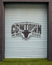 Logo for the Cowtown Marathon on a roll down garage door in the Foundry District`s Inspirational Alley in Fort Worth, Texas. Royalty Free Stock Photo