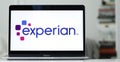 Logo design of experian on a laptop screen in blurred background