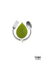 A logo design featuring a green leaf centered between a silver fork Royalty Free Stock Photo