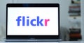 Logo design of flickr on a laptop screen in blurred background