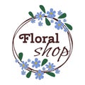Logo design for a floral shop with blue flowers and green leaves wreath. Elegant brown text Floral Shop inside the