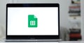 Logo design of google sheets on a laptop screen in blurred background Royalty Free Stock Photo