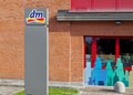 The logo of dm, Drogerie Markt, outside the recently opened store. Royalty Free Stock Photo