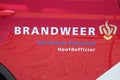 Logo of the dutch fire fighters brigade in the Netherlands with name Brandweer in dutch of the Rotterdam Brigade in the car of th