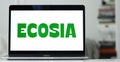 Ecosia search engine logo on laptop screen. Ecosia plants trees with ad revenue.