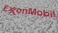 Logo of EXXON MOBIL being made with puzzle pieces, editorial 3D rendering